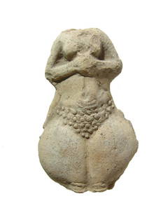 A torso from a Near Eastern terracotta figure: A torso from a Near Eastern terracotta figure, c. 3rd Century BC, a type well-known from the site of Susa, the piece is frontally molded, with exaggerated hip and large pubic region, hands together