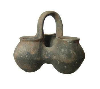 A choice Yortan culture kernos: A choice Yortan culture kernos from Anatolia, Early Bronze Age II, c. 2700 - 2400 BC, comprised of three ovoid compartments, each with narrow flattened bottoms and joined together with a tall strap