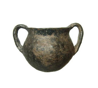 An attractive Yortan black-ware two-handled jar: An attractive Yortan black-ware two-handled jar, Anatolia, Early Bronze Age II, c. 2700 - 2400 BC, with rounded body and flared mouth, the two strap handles pierced to suspend the vessel. 3 7/8 x 5