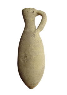 A Late Bronze Age ceramic juglet, Holy Land: A Late Bronze Age ceramic juglet, Holy Land, c. 1500 - 1200 BC, yellowish buff, the body of long ovoid shape with pointed bottom, the neck narrows with wide mouth and single handle. H: 8 3/8 in (21.3