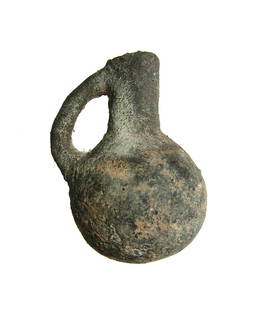 Iron Age II black-ware juglet from the Holy Land: An Iron Age II black-ware juglet from the Holy Land, c. 1000 - 600 BC, with rounded body, cylindrical neck and single handle. H: 3 in (7.6 cm). Light deposits. Ex New York private collection,