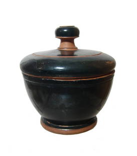 A nice Greek black-ware pyxis with original lid: A nice Greek black-ware pyxis with original lid, c. 5th Century BC, with great glossy black surfaces, the well-formed lid with groove around the knob handle. 4 1/4 x 4 in (10.7 x 10.2 cm). Ex German