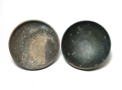 A pair of Greek footed bowls, Magnia Graecia: A pair of Greek footed bowls, Magnia Graecia, 4th Century BC, both well-preserved with good black glaze. 5 1/2 x 2 3/8 in (14 x 6 cm) & 5 1/2 x 2 1/8 in (14 x 5.4 cm). One with earthen encrustation.