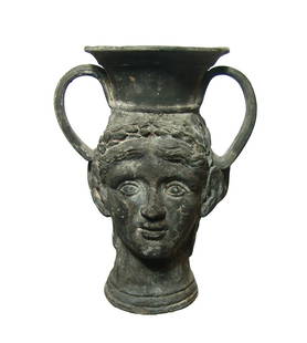 A Hellenistic black-ware janiform kantharos: A Hellenistic black-ware janiform kantharos, c. 3rd - 2nd Century BC, depicting satyrs, one portrait bearded with heavy features, the other more youthful with laurel-wreath and curled hair. The