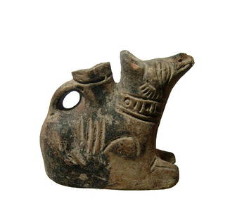 A Roman spouted jug in the form of a canine: A Roman spouted jug in the form of a canine, 3rd - 4th Century AD, slipped in the black, the dog is seated wearing a decorated collar, his ears alert and tail curled. Nice detailed and light surface