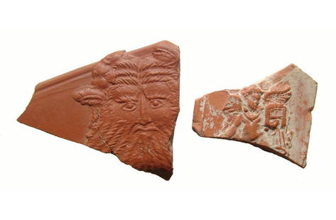 A pair of Roman red-ware pottery sherds: A pair of Roman red-ware pottery sherds from North Africa, c. 4th - 5th Century AD, one featuring the facing head of Oceanus in relief, wearing lobster headdress, 2 1/4 in x 2 in (5.7 x 5.2 cm), the