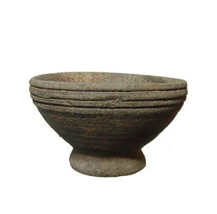 A Post-Medieval stone ware bowl: A Post-Medieval stone ware bowl, of heavy construction with pedestal foot and horizontal grooves below the rim. 3 1/4 x 5 1/4 in (8.3 x 13.3 cm). With deposits inside and out. Ex collection of Morley