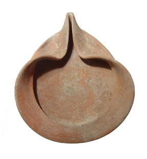 A very large and finely formed Judean oil lamp: A very large and finely formed Judean oil lamp, Iron Age, c. 1200 - 586 BC, with heavily pinched nozzle and wide rim. The lamp is extremely well preserved with light earthen deposits. L: 7 1/2 in