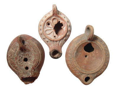 A lot of 3 Roman ceramic lamps: A lot of 3 Roman ceramic lamps. Lots include an orange-ware lamp with rosette within the discus, 1st Century AD, with raised pellets on shoulder, L: 4 1/4 in (10.7 cm), the next is an orange-ware lamp