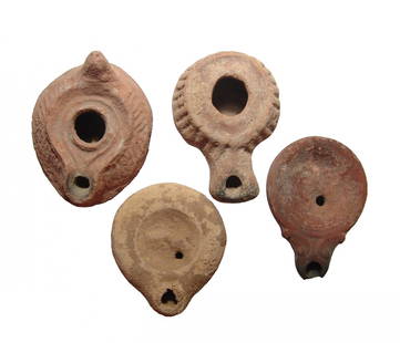 A lot of 4 ancient ceramic lamps: A lot of 4 ancient ceramic lamps. The first is a Roman type from the Holy Land, c. 3rd Century AD, with large fill-hole with vertical lines around the shoulder and wide nozzle, L: 3 1/2 in (8.9 cm),