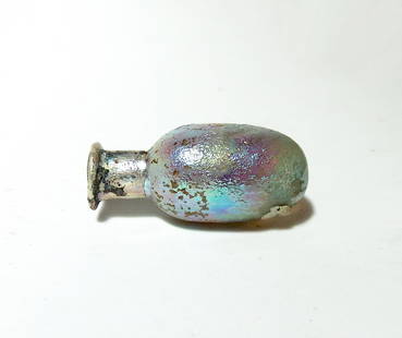 A lovely little Roman glass vessel: A lovely little Roman glass vessel, 1st - 2nd Century AD, with ovoid body, short cylindrical neck and flared mouth with inward folded rim. H: 2 1/8 in (5.4 cm). Losses to side of body, beautiful