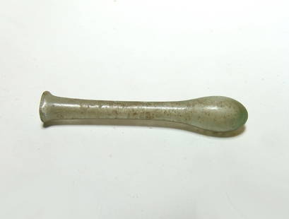 A Roman yellow-green glass tear drop vessel: A Roman yellow-green glass tear drop vessel, 1st - 2nd Century AD, with ovoid body, long narrow neck which flares with a wide mouth with inward folded rim. H: 3 1/2 in (8.9 cm). Light deposits. Ex