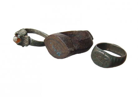 A lot of 3 bronzes rings - Byzantine - Medieval: A lot of 3 bronzes rings - Byzantine - Medieval. The first is a Byzantine bronze ring, c. 6th - 8th Century AD, with a stylized Tau-Rho symbol, 24 x 21 x 9 mm, ring size about 5 1/2. The second is a h