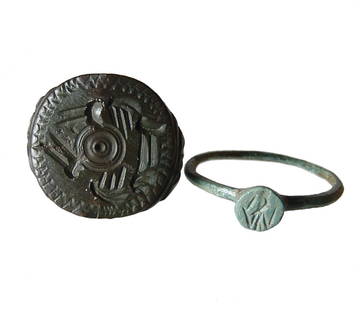 A pair of Roman and Byzantine rings: A pair of Roman and Byzantine rings. Lot includes a Roman bronze ring with an image on an eagle in intaglio within the small circular bezel, 13 x 25 mm, the second is a Byzantine bronze ring, c. 6th