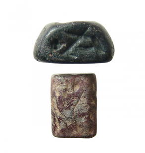 A pair of Levantine stone stamp seals: A pair of Levantine stone stamp seals. The first is in black steatite, c. 2nd Millennium BC, domed with central hole and flattened sides, each with a stylized figure or animal. 19 x 11 x 10 mm. The