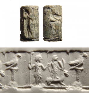 A wonderful Levantine green steatite cylinder seal: A Levantine green steatite cylinder seal, 2nd Millennium BC, depicting a pair of standing male figures, one holding a sceptre and the other placing his hand on a hare beside him. To right is a column