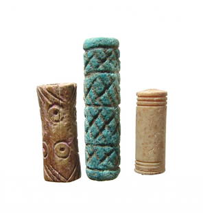 Group of 3 Near Eastern ceramic and bone seals/beads: A large Near Eastern glazed seal and two bone cylinder seal/beads. The first is a large Near Eastern glazed cylinder seal, c. 2nd Millennium BC, with four registers of cross-hatching. L: 4.7cm.