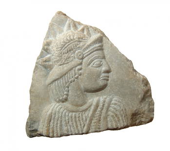 A modernly re-carved Near Eastern marble fragment: A modernly re-carved Near Eastern marble fragment with radiate male in relief. The original likely dated from the 2nd - 3rd Century AD, with perhaps some Roman influence, but it has been completely