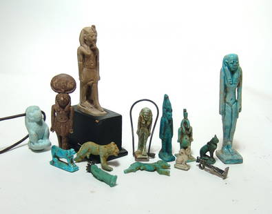 14 antique and tourist-type Egyptian amulet replicas: A group of 14 antique and tourist-type Egyptian amulet replicas, including various deities and animals. One is in sterling silver and another is set in a sterling pendant. An attractive group! Largest