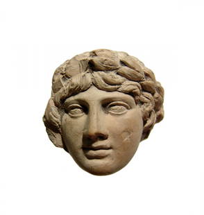 Lovely head of a youth in Hellenistic-style, 19th C.: A lovely relief of the head of a youth in Hellenistic-style, c. 19th Century, with full features, curled locks and wearing a laurel wreath. 2 3/8 x 2 3/8 in (6 x 6 cm). A beautiful piece! Ex