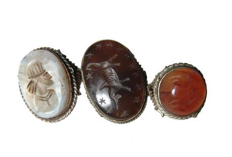 Group of large and attractive ancient-style replica: A group of large and attractive ancient-style replica rings. Each ring quite ornate and set with large intaglios - one in carnelian agate and depicting winged horse, about ring size 9 3/4, another