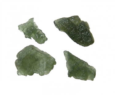 A group of 4 Moldavite tektites, Czech Republic: A group of 4 Moldavite tektites. Formed by a meteorite impact about 15 million years ago in southern Germany which left the Nördlinger Ries impact crater. The impact splattered molten material high