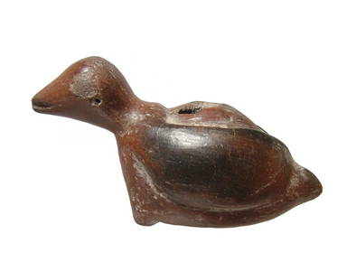 A cute little West Mexican ceramic bird figurine: A cute little West Mexican ceramic bird figurine, c, 100 BC - AD 250, with swept back wings, small feet and large eyes. The mottled brown slip is well preserved, and the vessel possesses a small