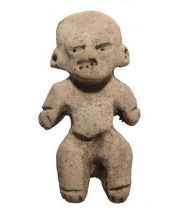 A cute miniature Huastec figurine, Mexico: A cute miniature Huastec figurine, Mexico, AD 600 - 900, a rare example, wearing large ear spools, the features somewhat stylized. H: 1 3/4 in (4.4 cm). Light deposits. Ex Southern California private