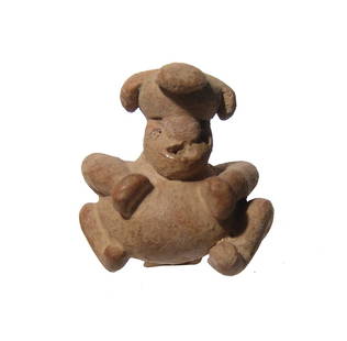 Costa Rican terracotta figurine from La Selva region: A Costa Rican terracotta figurine from La Selva region, c. AD 400 - 800, in the form of seated round-bodied male. H: 1 1/2 in (3.8 cm). Light deposits. Ex St. Paul private collection.