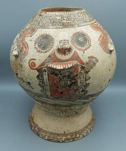 A massive Nicoya figural urn, Costa Rica: A massive Nicoya figural urn, Costa Rica, c. AD 1100 - 1500. This huge Pataky polychrome vessel portrays Tlaloc, the Rain God, depicted with protruding teeth, large double-ringed eyes and a large