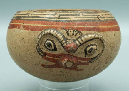 Lovely Nicoya polychrome bowl, Costa Rica: A lovely Nicoya polychrome bowl, Costa Rica, c. AD 1200 - 1500. This fine Vallejo Polychrome Janus form vessel features a pair of beautifully executed owl deity heads. The rim is decorated with