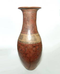 A large Narino bullet-shaped amphora: A large Narino bullet-shaped amphora, Colombia, c. AD 1000 - 1500, decorated with black resist geometric designs over red & creme slip. H: 25 in (63.3 cm). A couple restored breaks to lower part of