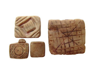 A group of 4 Inca marble domestic charms: A group of 4 Inca marble domestic charms, c. AD 1300 - 1500, each bearing incised geometric designs likely for ritual use. Largest 1 1/2 x 1 3/8 in (3.8 x 4.2 cm). Ex collection of Prof. Theodore