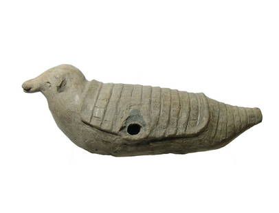 An interesting La Tolita ceramic figure of an armadillo: An interesting La Tolita ceramic figure of an armadillo, Ecuador, c. 350 BC - AD 350, with creme burnished surfaces and strong detail, the four legs now lost. L: 8 1/2 in (21.5 cm). Ex J. Klamer