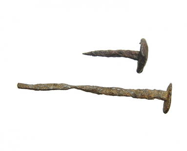 A pair of Roman iron nails from Judaea: A pair of Roman iron nails, 1st - 4th Century AD, unearthed in Safad, Israel, in 1975 within the remains of a Roman era carpentry shop. Both are nice examples! 3 1/2 in x 3/4 in (8.9 x 2 cm) & 1 3/5