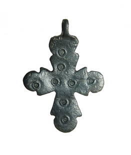 A nice Byzantine bronze cross pendant: A nice Byzantine bronze cross pendant, c. 8th - 10th Century AD, with incised circular decoration and surmounted by a suspension loop. 1 ¾ in x 1 ¼ in (4.4 x 3.2 cm). Nicely patinated. Ex Southern C