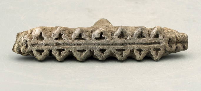 A rare Azcapotzalco stamp, Mexico: A rare Azcapotzalco stamp, Mexico, c. AD 1300 - 1500. This fine, flat stamp creates a complex geometric design, perhaps intended to represent a rattle snake. L: 4 ¼ in (10.7 cm). In a well-preserved