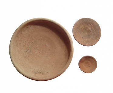 A pair of Egyptian offering dishes and a Roman bowl: A pair of Egyptian offering dishes and a Roman bowl. Lot includes a pair of Egyptian ceramic offering dishes of a type which are found throughout the long history, from Old Kingdom to the Roman