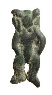 A Levantine bronze amulet of a standing deity: A Levantine bronze amulet of a standing deity, c. 1000 - 400 BC, the head small with ear-like projections and arms at sides. L: 1 1/4 in (3.2cm). Nicely patinated. Ex Pennsylvania private collection