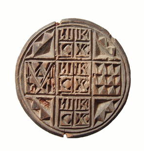 A nice Greek wooden bread stamp, c. 19th Century: A nice Greek wooden bread stamp, c. 19th Century, circular with small square handle, 'Jesus Christ Victorious' within central three squares of a gridded geometric decoration and atop the handle. Dia: