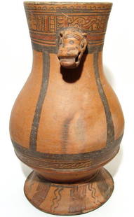 A huge Greater Nicoya polychrome ceremonial vessel: A huge Greater Nicoya polychrome ceremonial vessel, AD 1200 - 1550, Jicote variety, with rattle in the jaguar formed head, and typical registers of jaguar motif iconography. The vessel sits on a