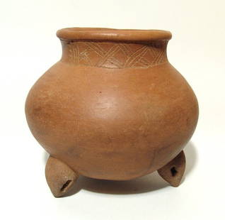 An early Nicoya Guinea incised bulbous bowl, Costa Rica: An early Nicoya Guinea incised bulbous bowl, Costa Rica, c. AD 200 - 500, with collar incised register, tripod support rattles and a pleasing tan, matte finish. 7 in x 7 3/4 in (17.8 x 19.7 cm).