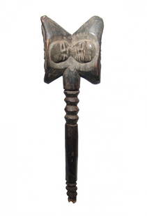 A nice West African wood mallet, early 20th Century: A nice West African wood mallet, early 20th Century, nicely carved, the sides with two facing human heads wearing a domed headdress featuring a floral element and two confronted heads on either side.