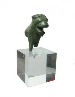 Seljuk bronze applique in lion form: A nice Seljuk bronze applique in the form of the forepart of a lion, 11th - 12th Century AD, with open mouth and ears back, the mane along the top of the head and eyes nicely incised. The back