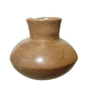 A Nayarit Post-Classic creme jar, West Mexico: A Nayarit Post-Classic creme jar, West Mexico, AD 900 - 1200, the body wide with harrow spout. The surfaces are burnished glossy with scattered deposits. 5 1/2 x 6 5/8 in (14 x 16.8 cm). Ex Petersen