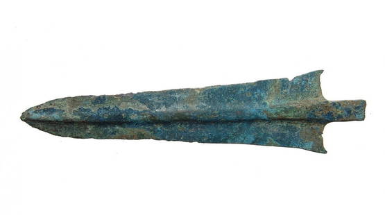 A well-preserved Near Eastern bronze spear head: A well-preserved Near Eastern bronze spear head, c. 1200 - 600 BC, the tapered blade with rounded midrib. The shoulders are lightly concave with flared tips and the mounting tang is short with