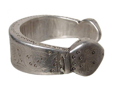 A large and impressive Ottoman silver bracelet: A large and impressive Ottoman silver bracelet, 18th - 19th Century, with snake head terminals, the face of the bracelets decorated with incised floral motif and circles, a row of circles also along