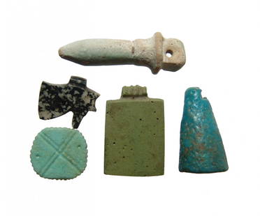 A nice group of Egyptian amulets, Late Period: A group of Egyptian amulets, Late Period, c. 664 - 332 BC, an include a nice diorite granite Eye of Horus amulet, 15 x 13 mm, a green faience amulet in the form of a writing tablet, 23 x 15 mm, a pale