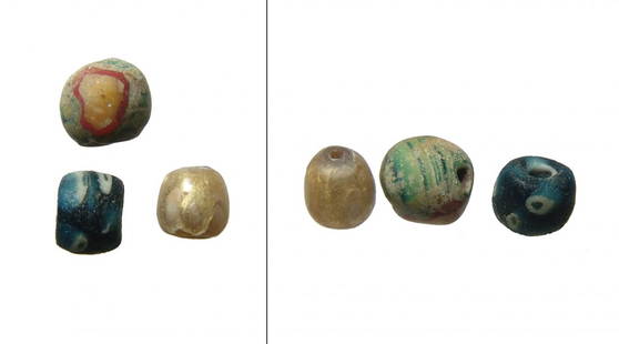 An attractive lot of 3 Roman glass beads: An attractive lot of 3 Roman glass beads. Lot includes a Roman gold glass bead, c. 1st Century BC - 1st Century AD, Dia: 9 mm, the second is a Hellenistic - early Roman speckled eye bead, c. 2nd