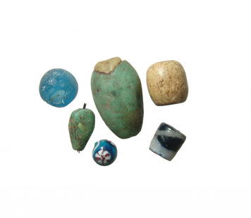 A nice lot of 6 Roman and later glass beads: A nice lot of 6 Roman and later glass beads. Lot includes four Roman glass beads, c. 1st - 3rd Century AD, two in opaque green glass, one in opaque yellow glass and a third in translucent blue glass.